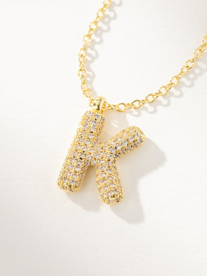 ["Bubble Letter Necklace 2.0 ", " Gold K ", " Product Image ", " Uncommon James"]