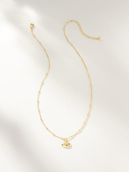 ["Football Pendant Necklace ", " Gold ", " Product Image ", " Uncommon Lifestyle"]