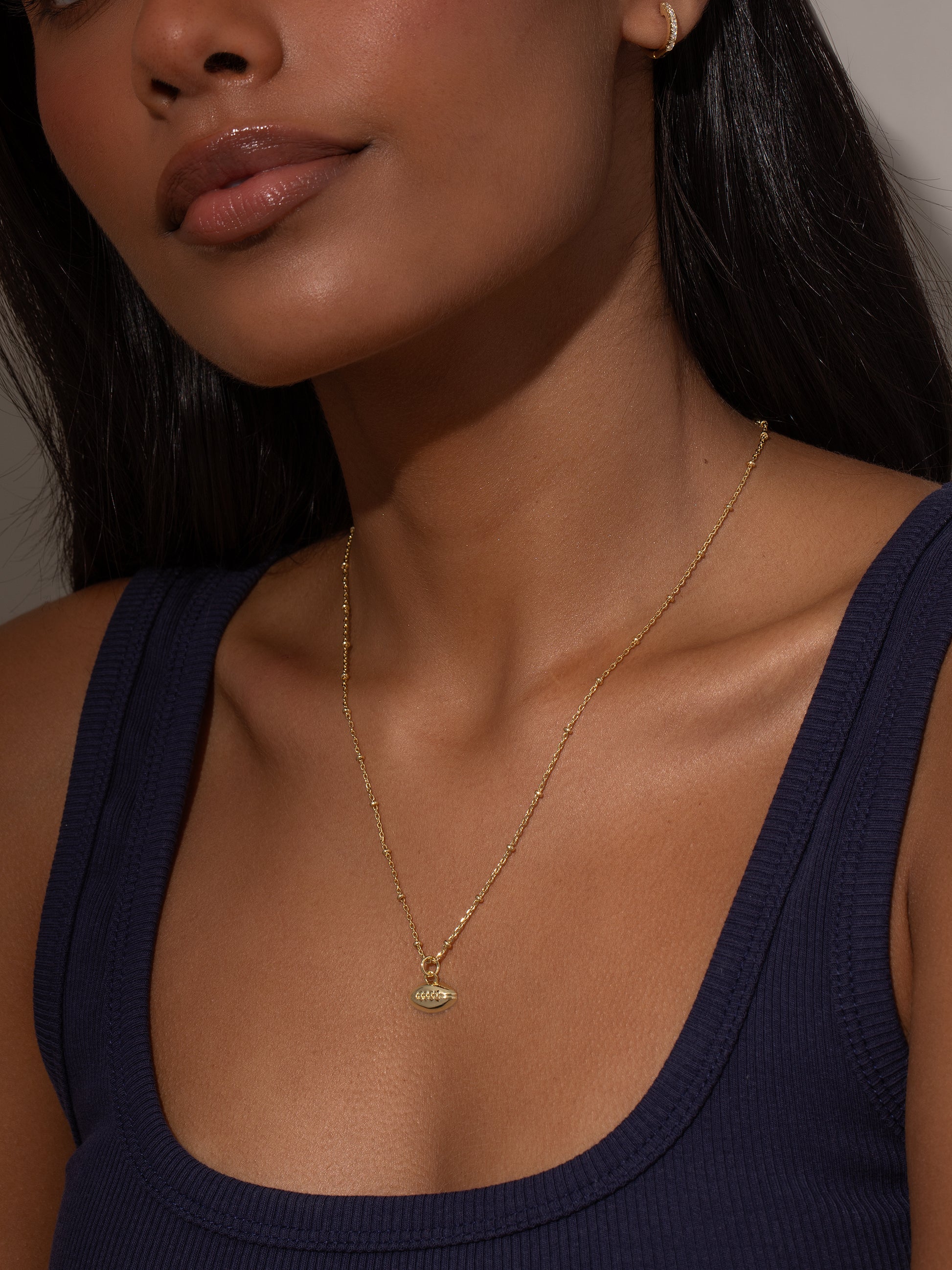 Football Pendant Necklace | Gold | Model Image | Uncommon Lifestyle