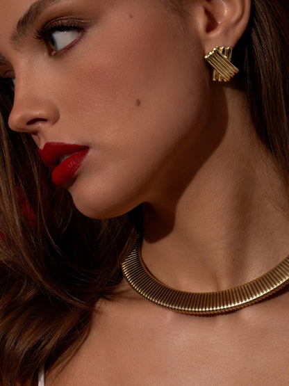 ["Omega Collar Necklace ", " Gold ", " Campaign Image ", " Uncommon James"]