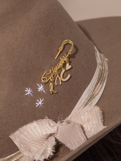 ["UJ x Rustler Howdy Pin ", " Gold ", " Model Image ", " Uncommon James"]