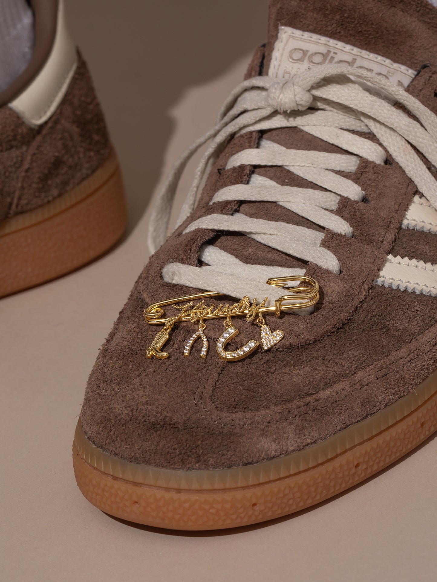 UJ x Rustler Howdy Pin | Gold | Model Image | Uncommon James