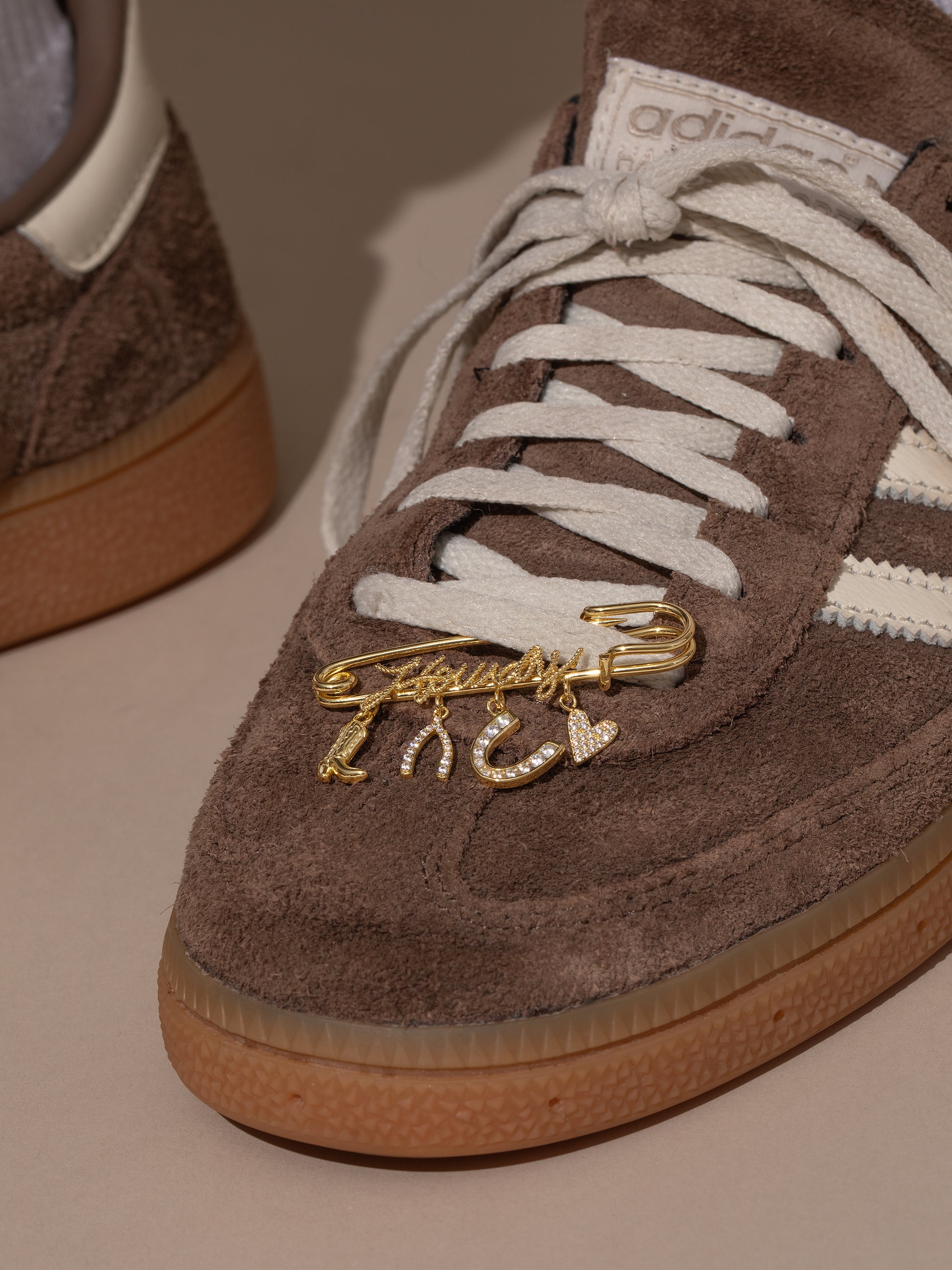 UJ x Rustler Howdy Pin | Gold | Model Image | Uncommon James