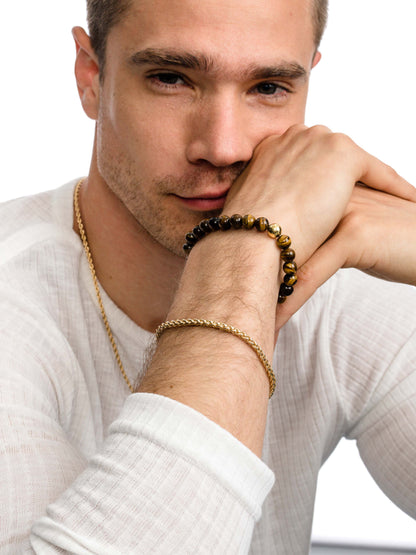 ["Men’s Wheat Chain Bracelet 4mm ", " Gold ", " Model Image 2 ", " Uncommon James"]