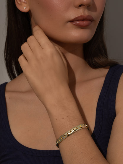 ["Eden Statement Chain Bracelet ", " Gold ", " Model Image ", " Uncommon James"]