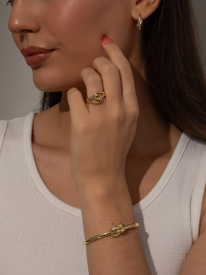 ["Forever Knot Cuff Bracelet ", " Gold ", " Model Image ", " Uncommon James"]