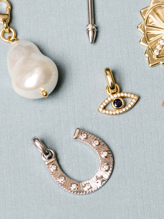 Horseshoe Charm | Silver | Flatlay Image | Uncommon James