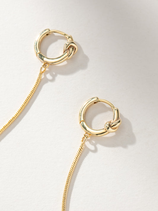 Forever Knot and Chain Huggie Earrings | Gold | Product Image | Uncommon James