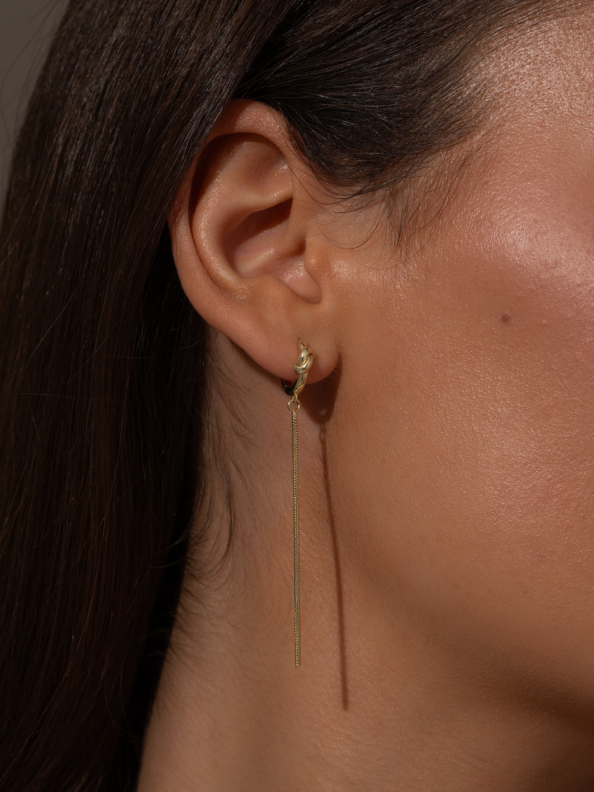 Forever Knot and Chain Huggie Earrings | Gold | Model Image | Uncommon James