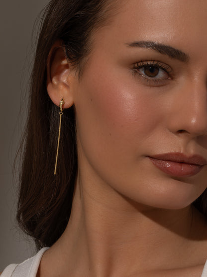 ["Forever Knot and Chain Huggie Earrings ", " Gold ", " Model Image ", " Uncommon James"]