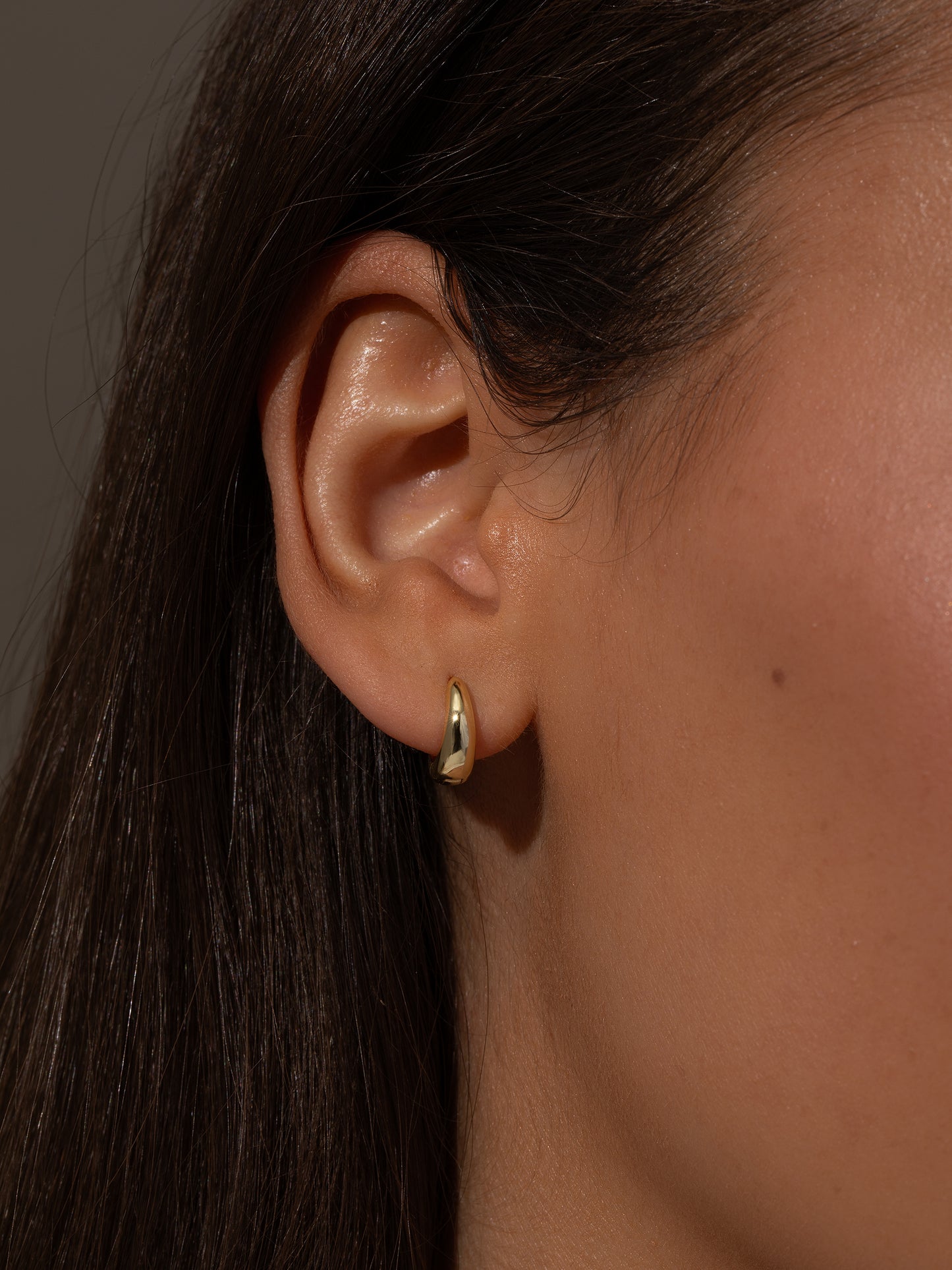 Teardrop Huggie Earrings | Gold | Model Image | Uncommon James