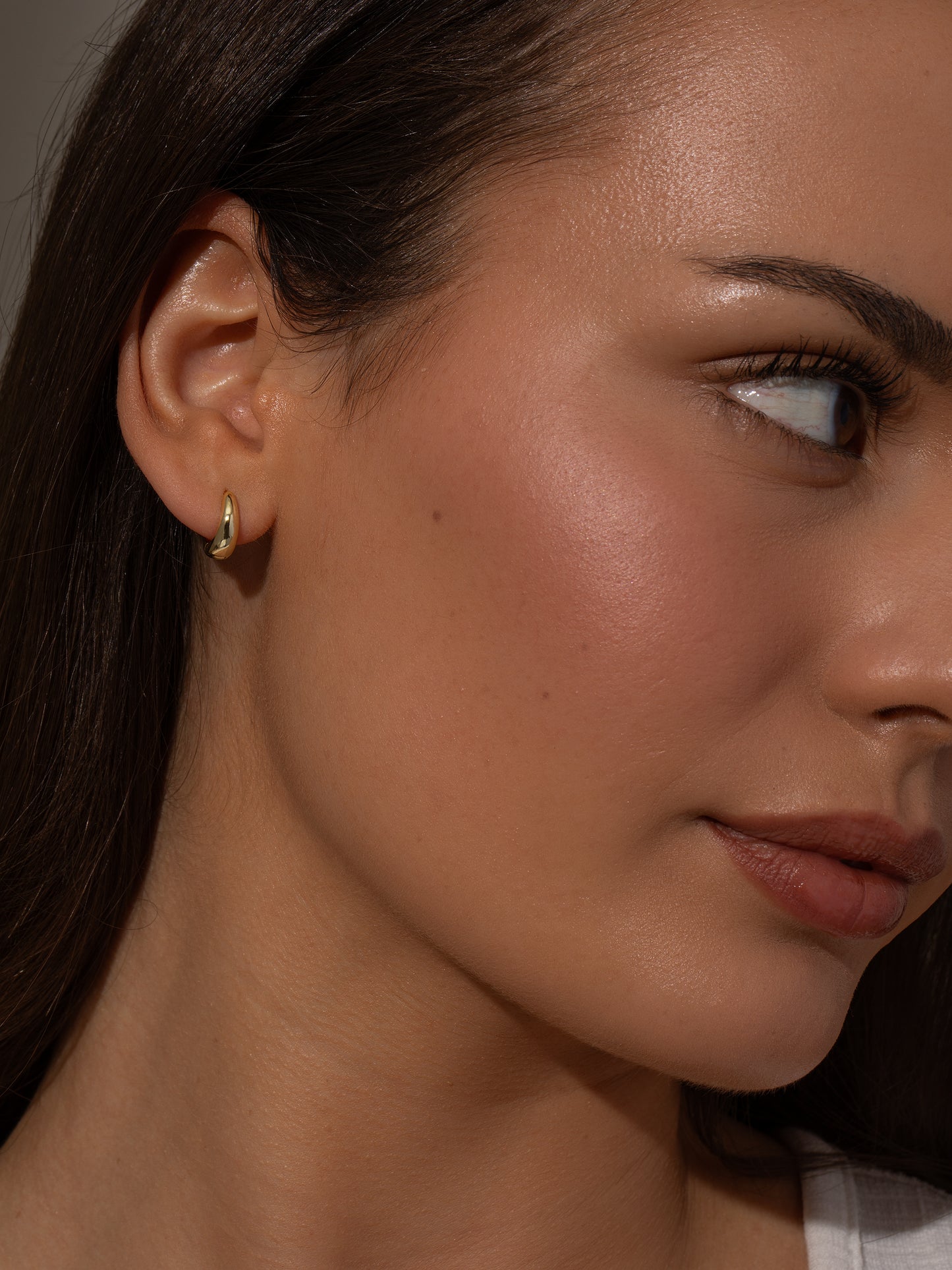 Teardrop Huggie Earrings | Gold | Model Image | Uncommon James