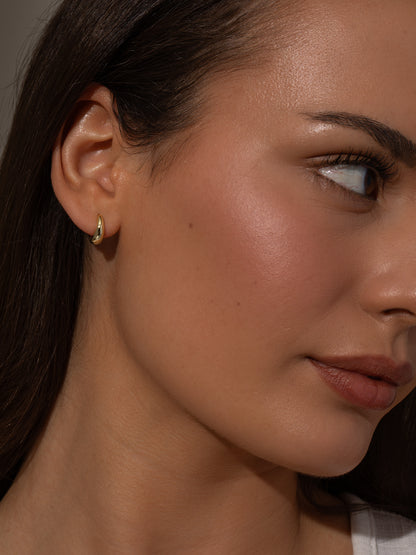 ["Teardrop Huggie Earrings ", " Gold ", " Model Image ", " Uncommon James"]