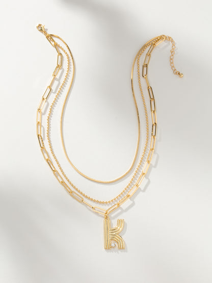["Muse Initial Layered Necklace ", " Gold ", " Product Image ", " Uncommon James"]