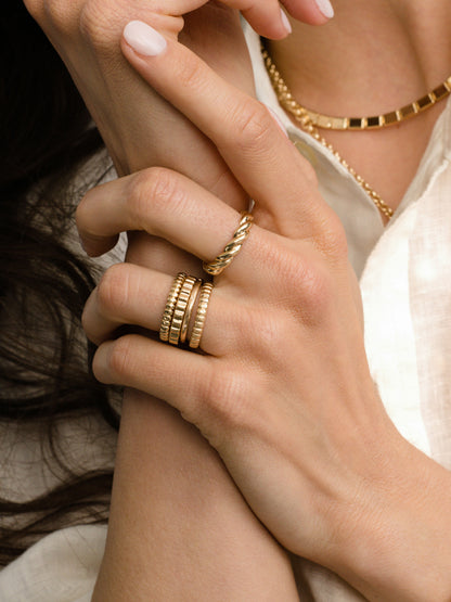 ["Tide Twist Ring ", " Gold ", " Model Image ", " Uncommon James"]