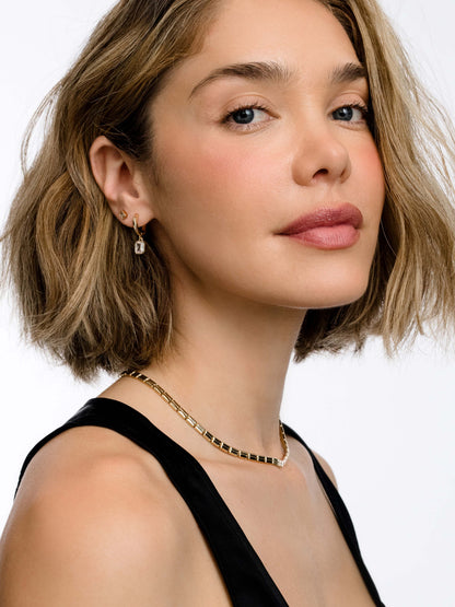 ["Emerald Huggie Earrings ", " Gold ", " Product Image ", " Uncommon James"]