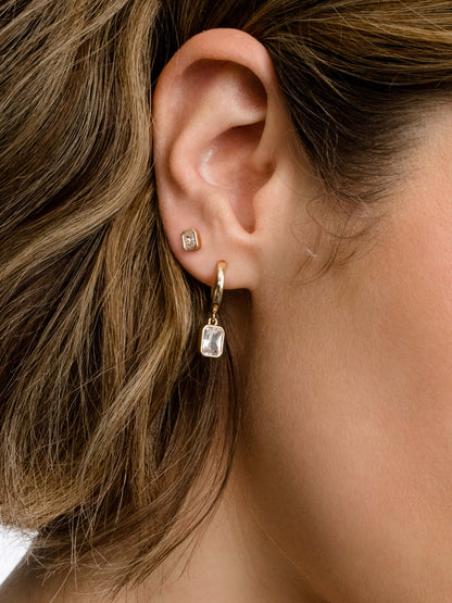 ["Emerald Huggie Earrings ", " Gold ", " Product Image ", " Uncommon James"]