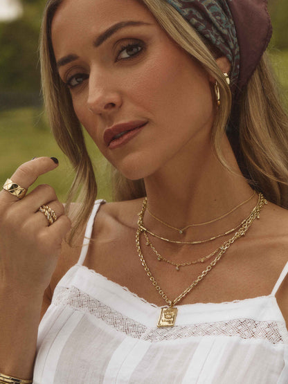 ["Daydreaming Chain Necklace Stack ", " Gold ", " Campaign Image ", " Uncommon James"]