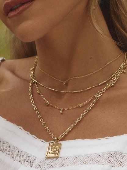 ["Daydreaming Chain Necklace Stack ", " Gold ", " Product Image ", " Uncommon James"]