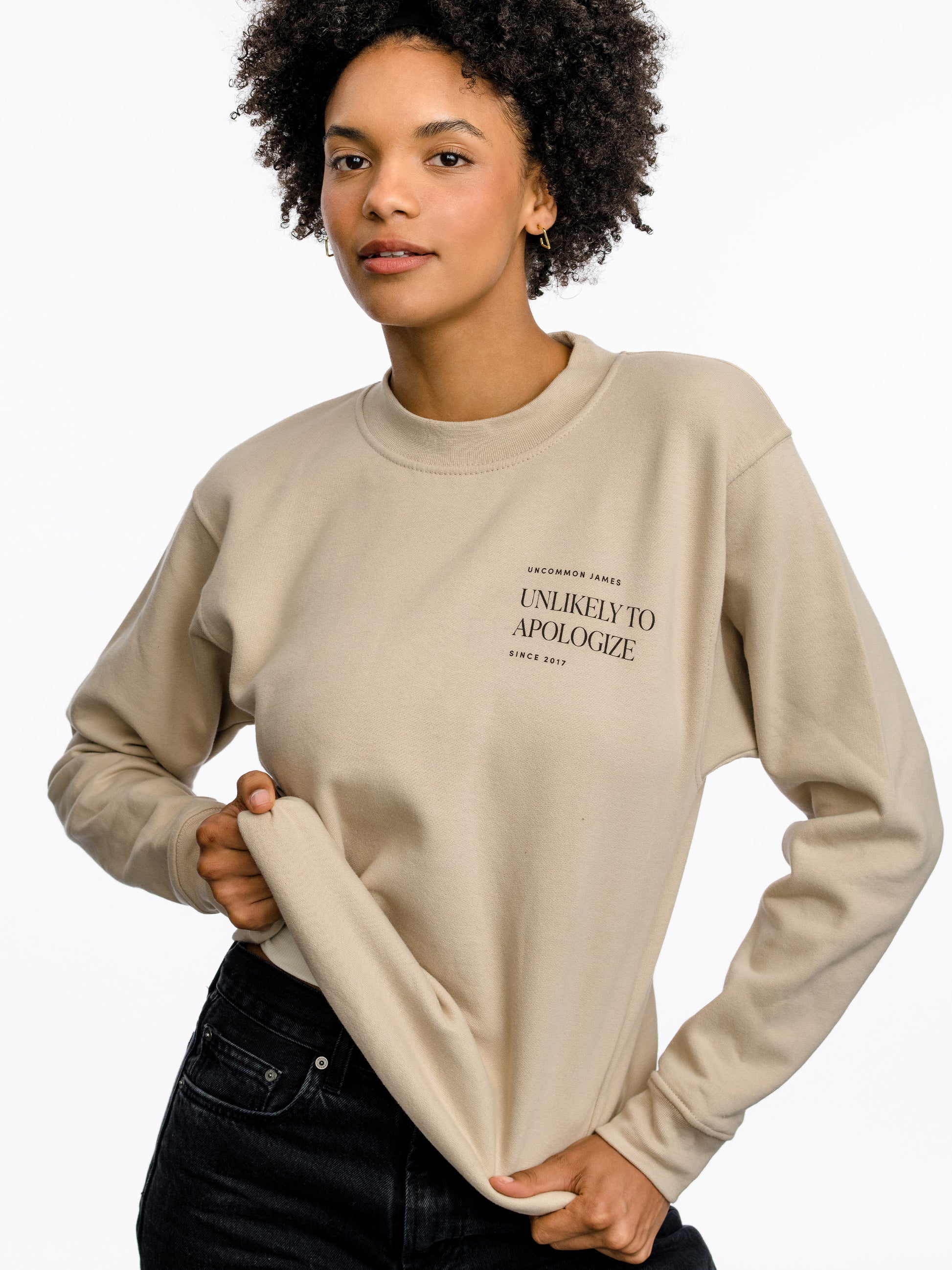 Unlikely to Apologize Sweatshirt | Beige | Model Image | Uncommon James