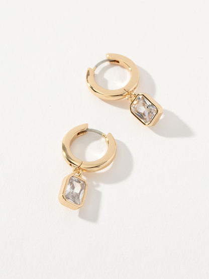 ["Emerald Huggie Earrings ", " Gold ", " Product Image ", " Uncommon James"]