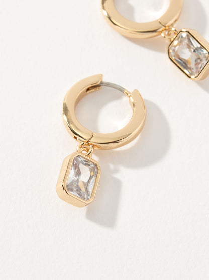 ["Emerald Huggie Earrings ", " Gold ", " Product Image ", " Uncommon James"]